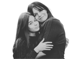 a parent and a young teen in a supportive hug