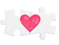 two puzzle pieces fitting together with a heart linking them